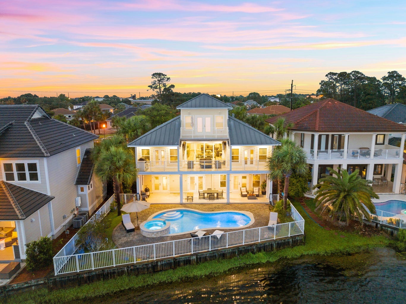 Twilight over the Destin To Relax estate and lit pool