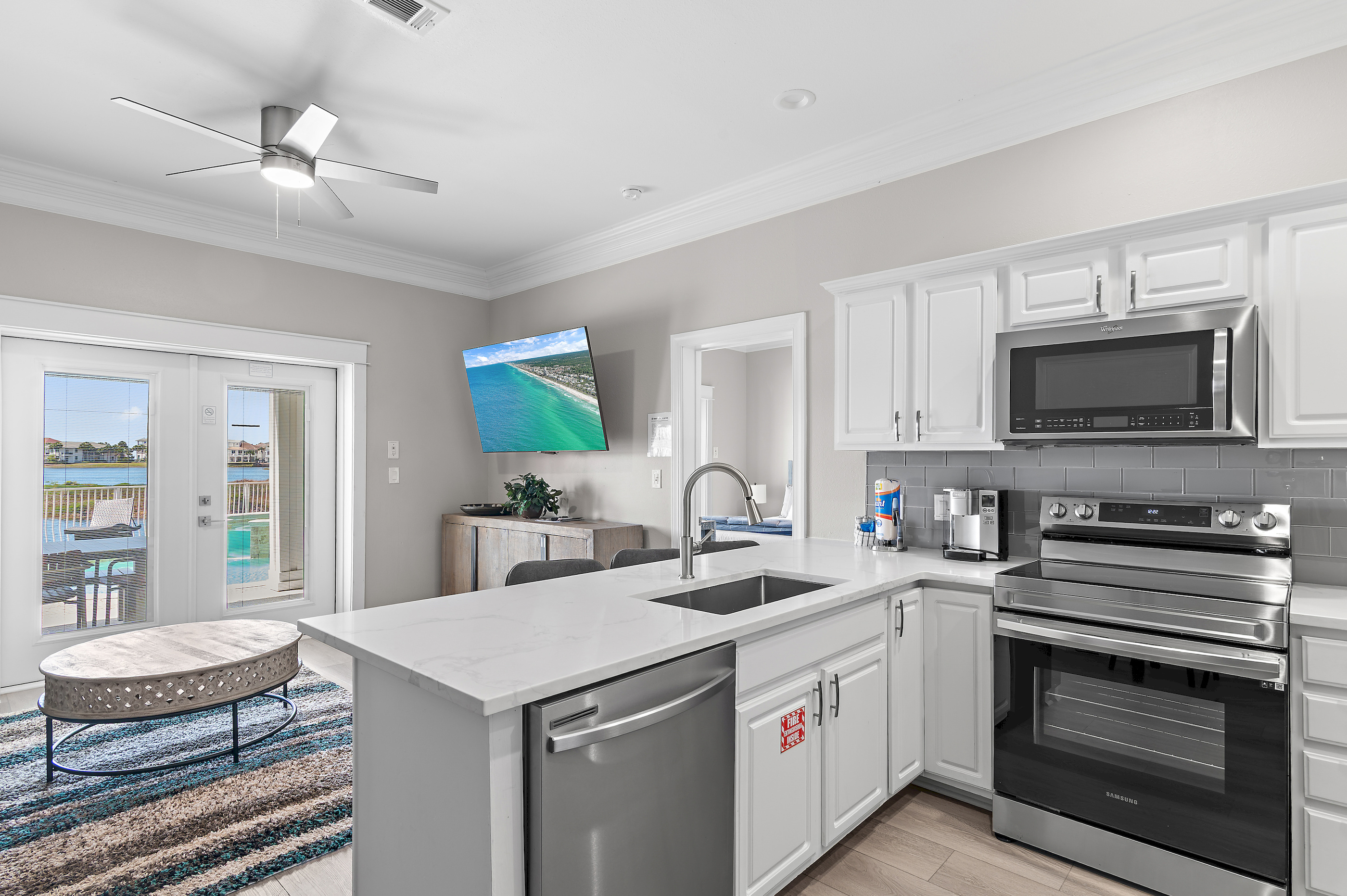 Main kitchen with granite counters and gas range