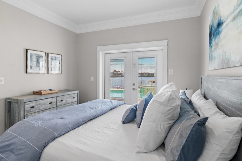 Bright guest bedroom with queen bed