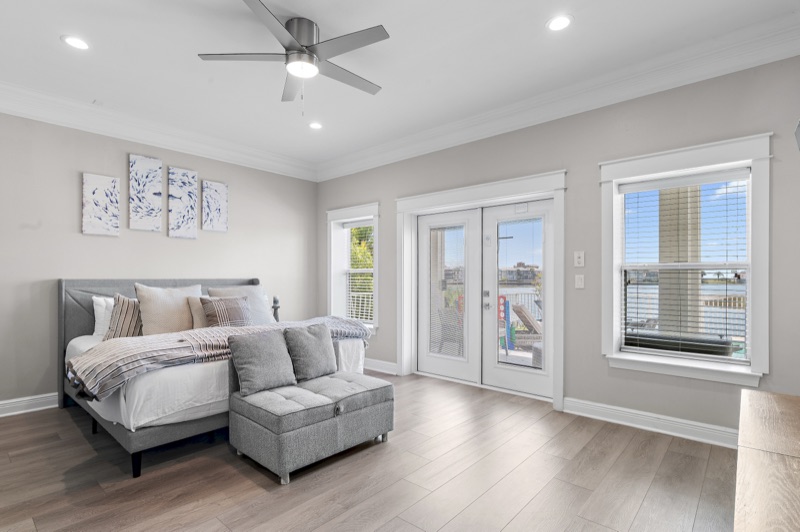 Guest bedroom with queen bed and lake view